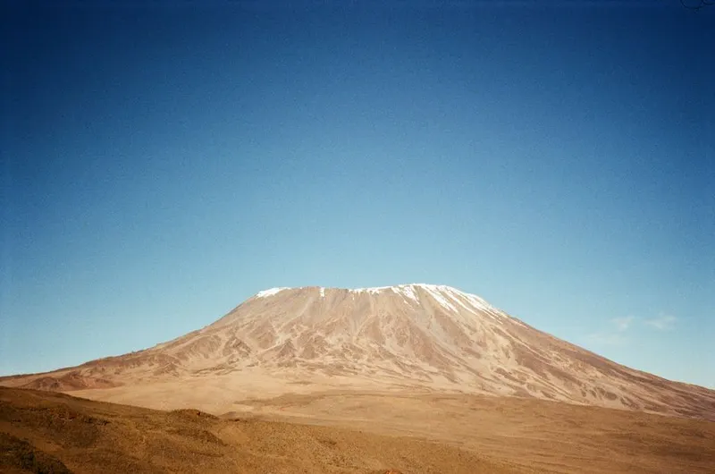 Summit Kilimanjaro (or a comparable peak)