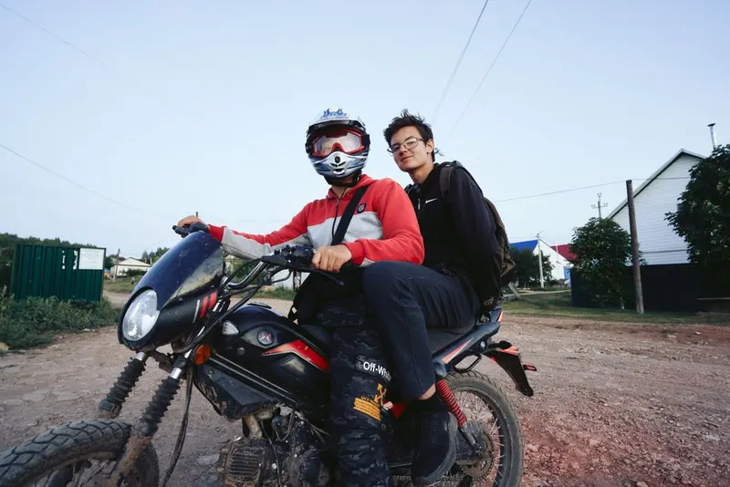 Ride a motorcycle across a country